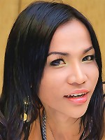 Pretty ladyboy Fai shows off her curves on the bed